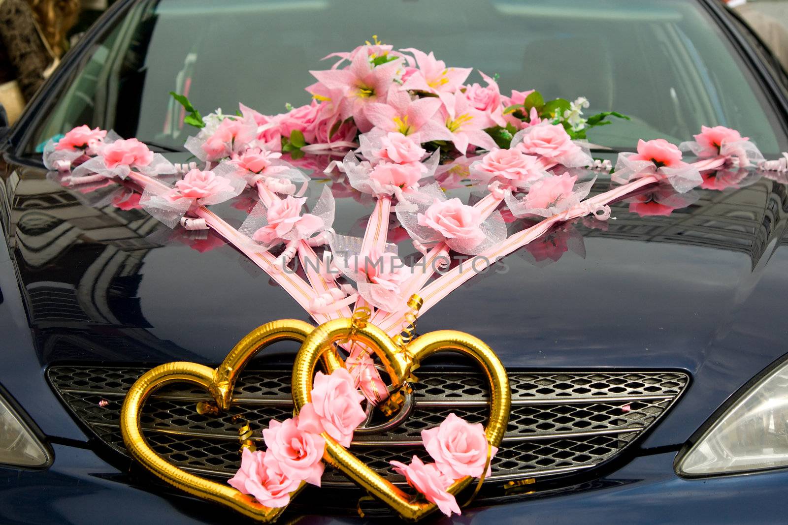 The decorated wedding car.