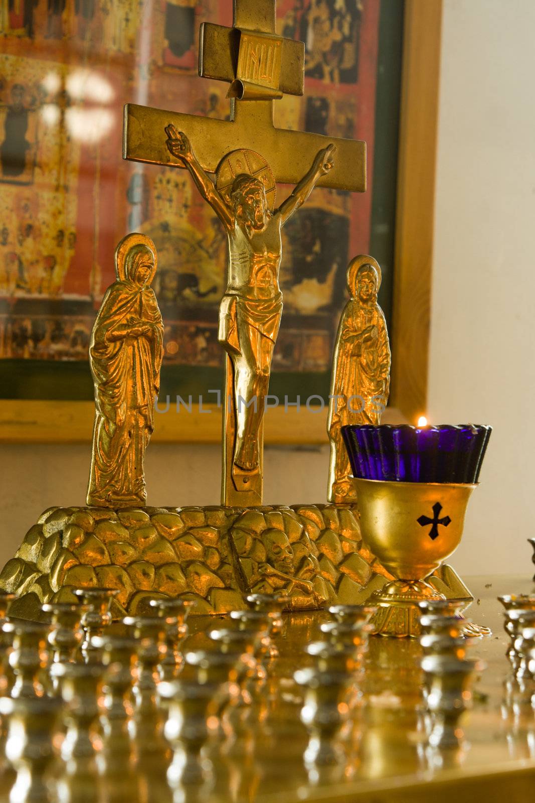 Jesus Christ's crucifixion. A burning candle.