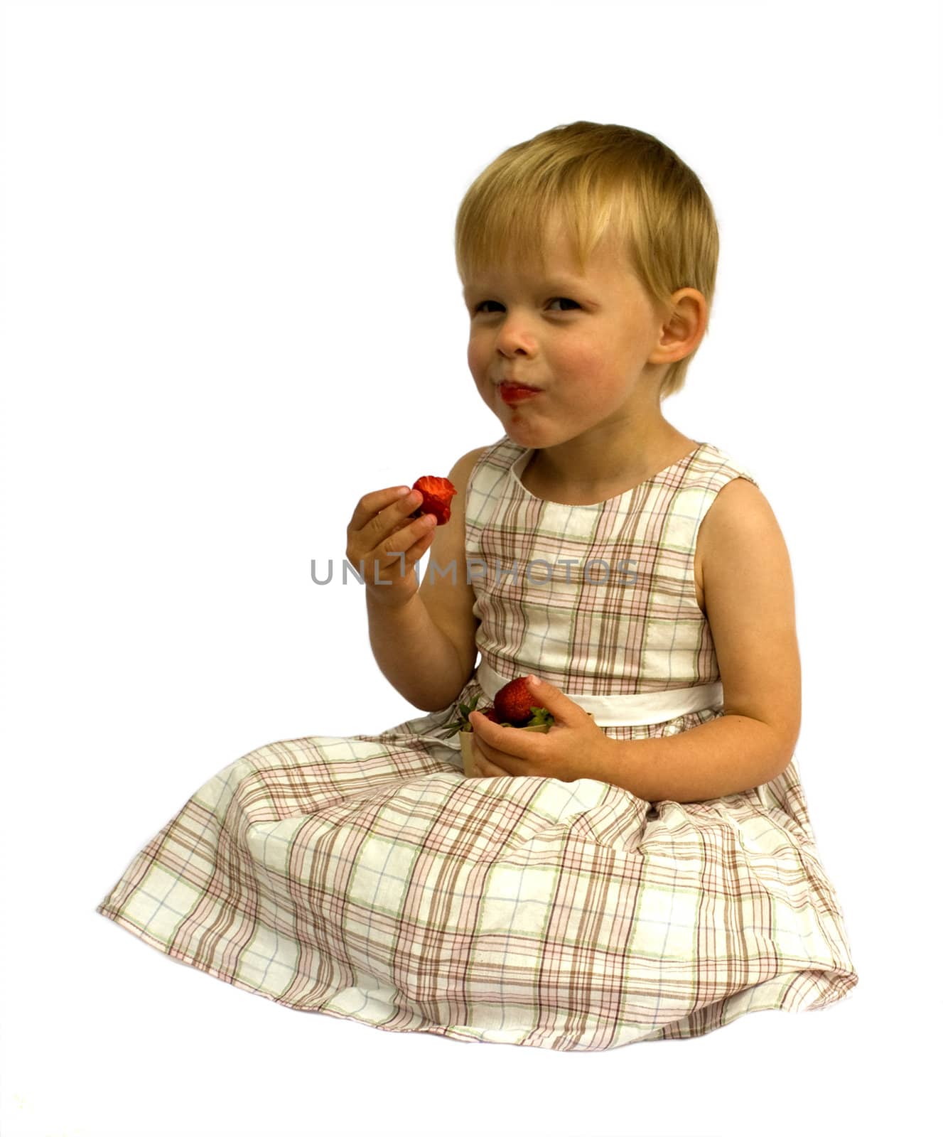 Girl eating strawberries, isolated on white background