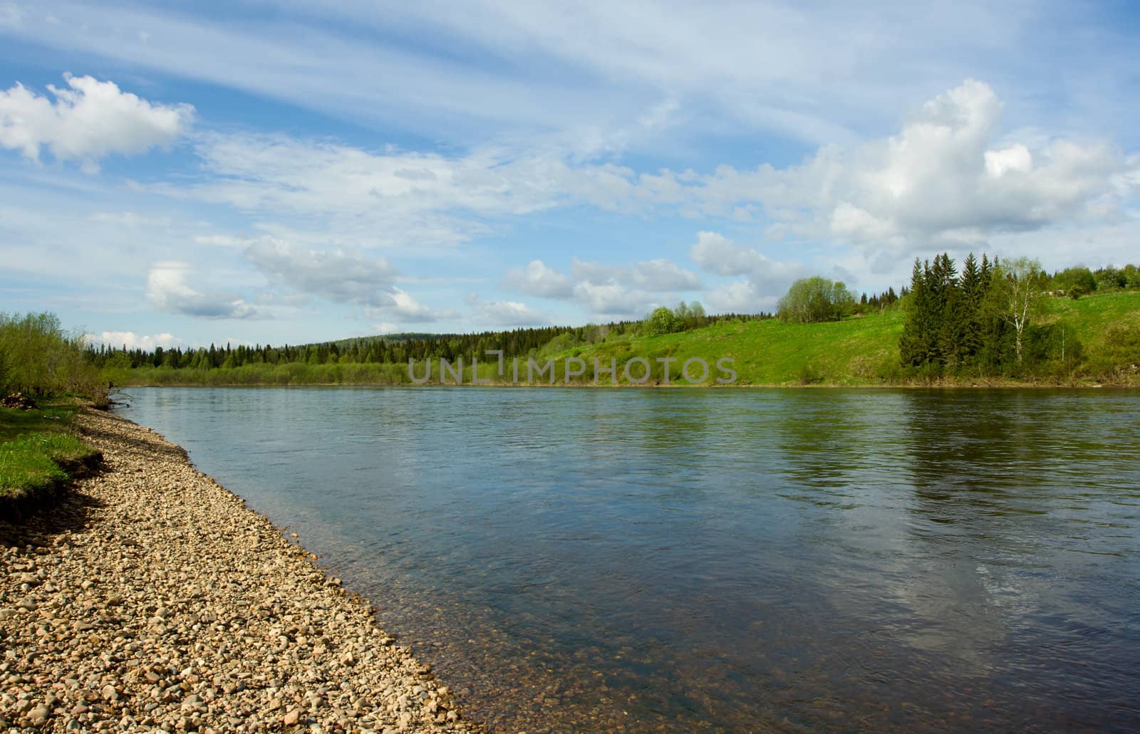 Summer landscape. Clouds above the river.