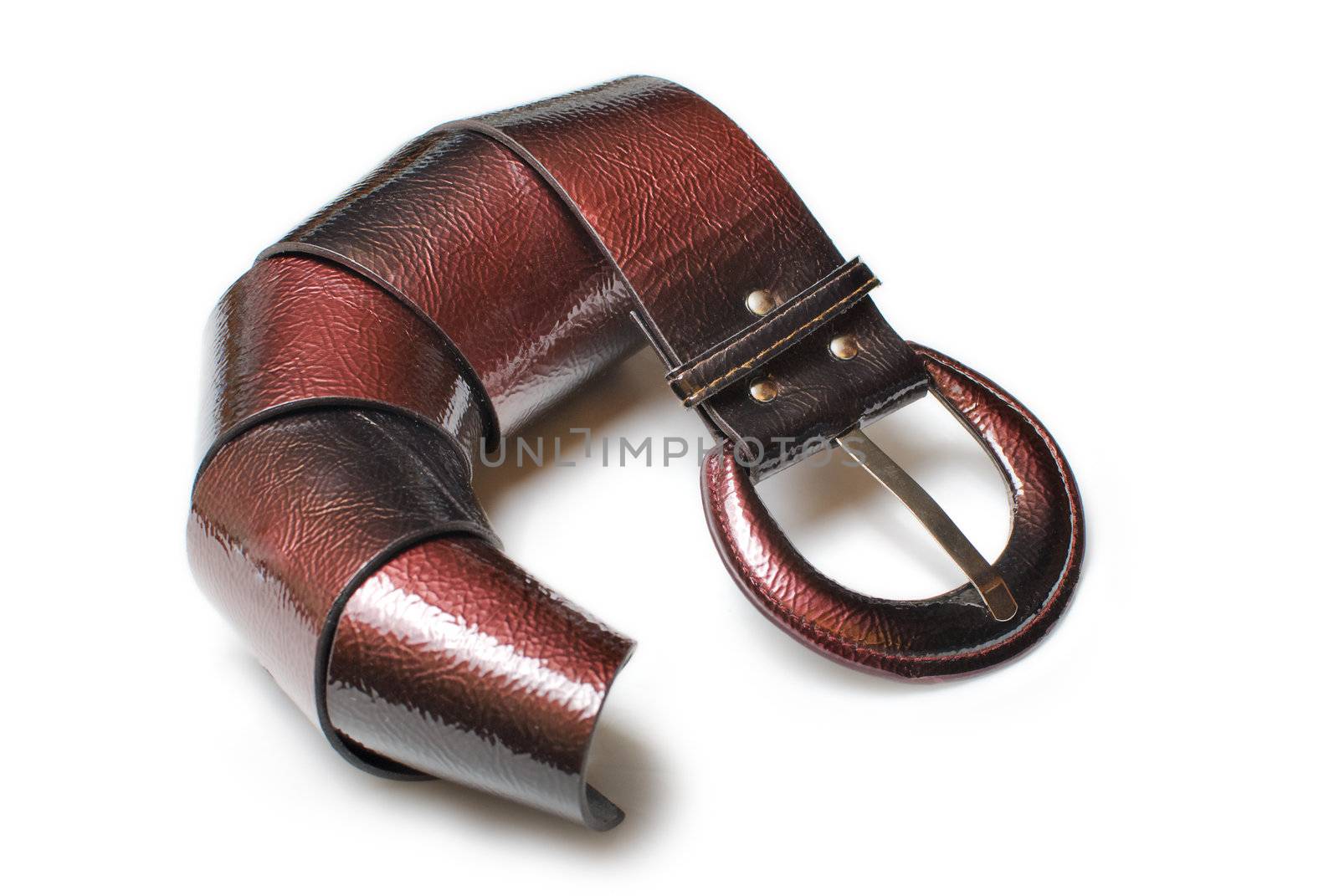 Red woman leather belt curved and isolated on white back ground
