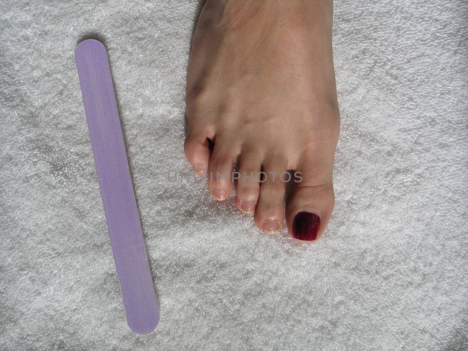 female foot during a pedicure set up by mmm