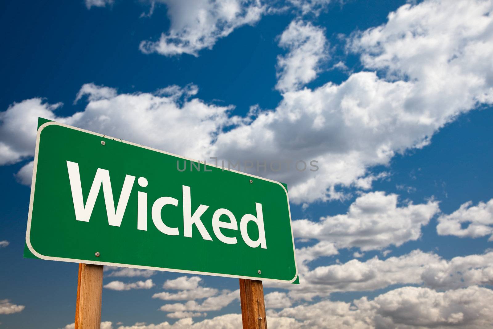 Wicked Green Road Sign with Dramatic Clouds and Sky - The Kudos Sign Series.