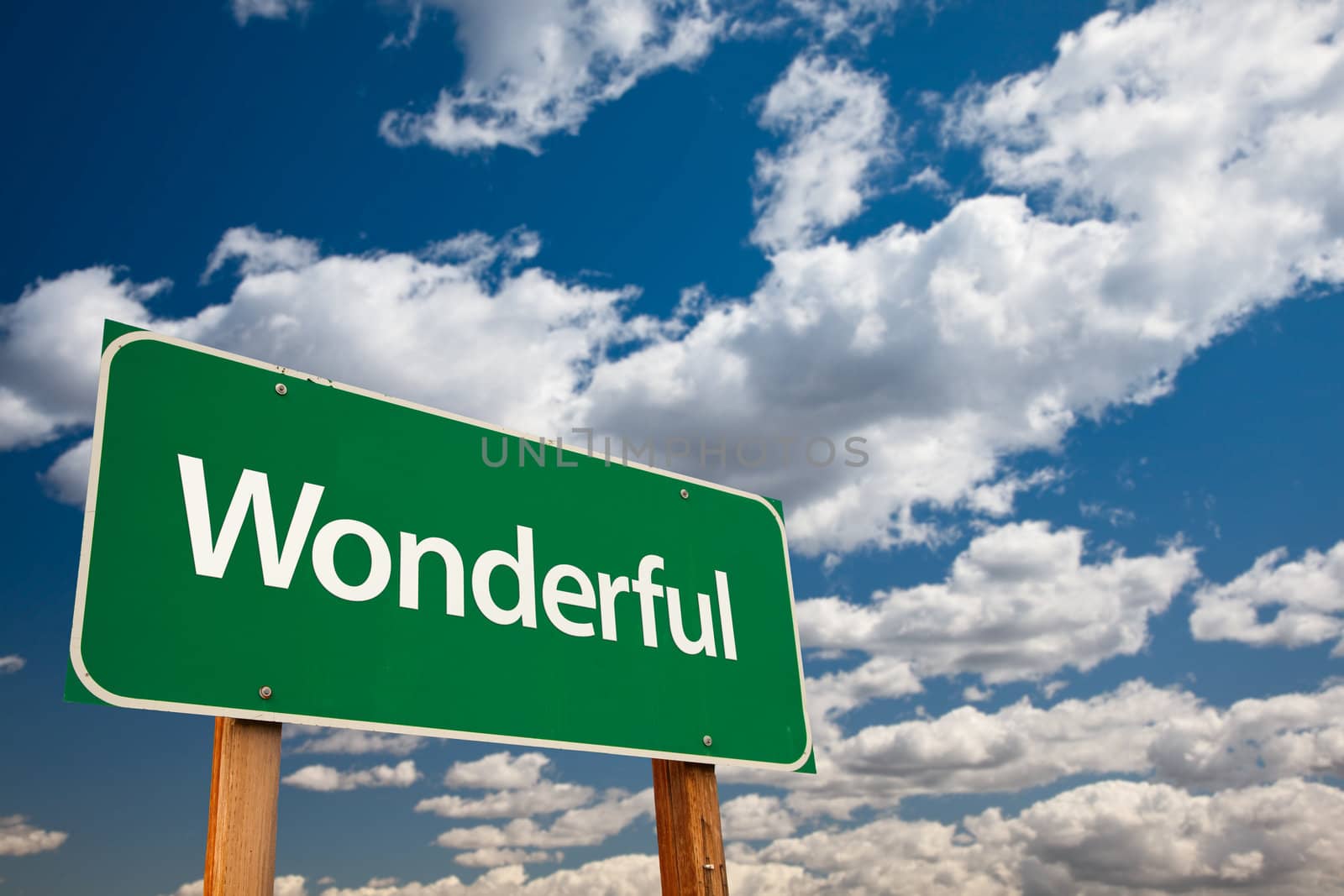 Wonderful Green Road Sign with Dramatic Clouds and Sky - The Kudos Sign Series.