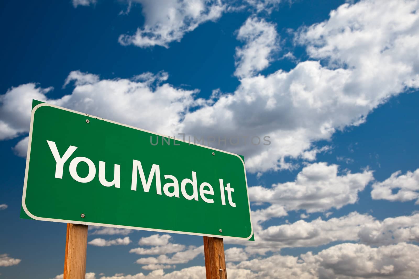 You Made It Green Road Sign with Dramatic Clouds and Sky - The Kudos Sign Series.