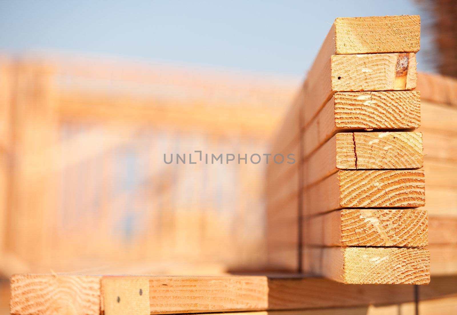 Stack of Building Lumber at Construction Site with Narrow Depth of Field.