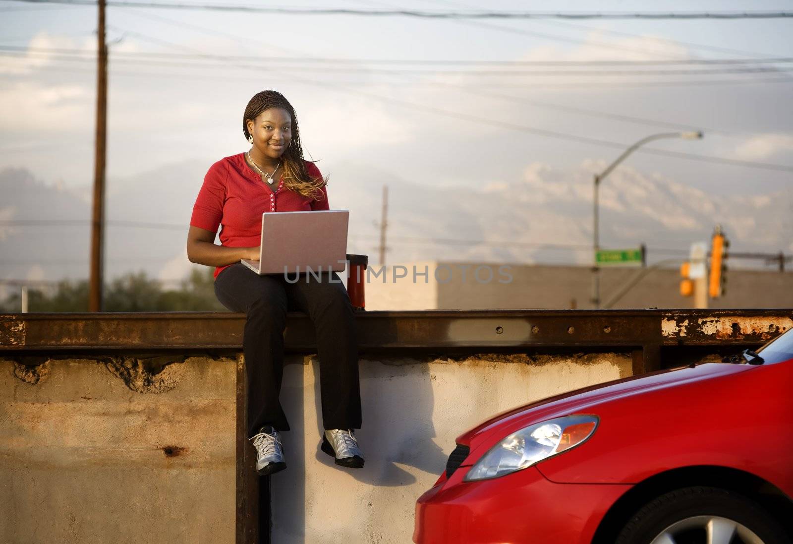 Pretty African American woman with laptop computer