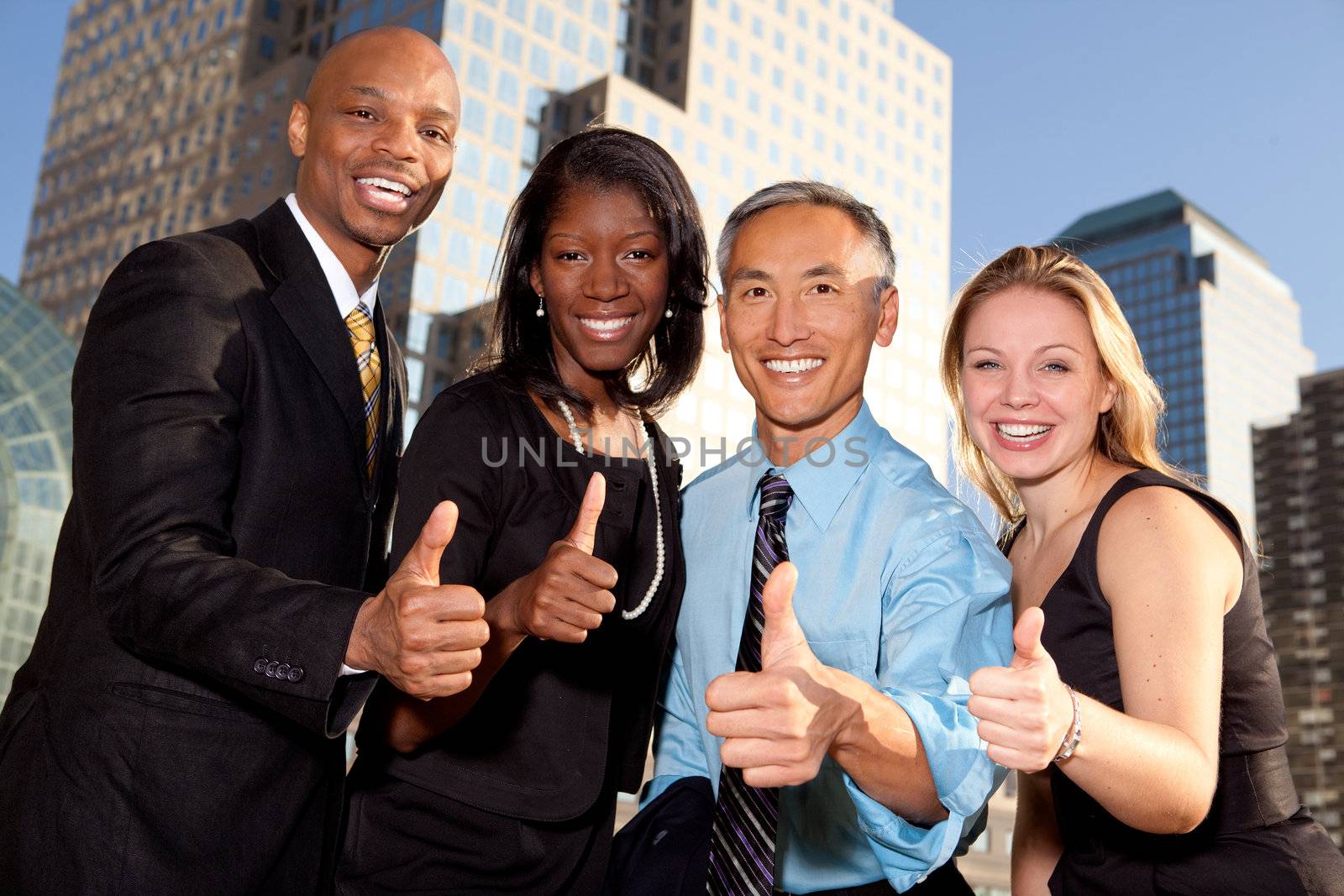 a group of business people giving a thumbs up sign