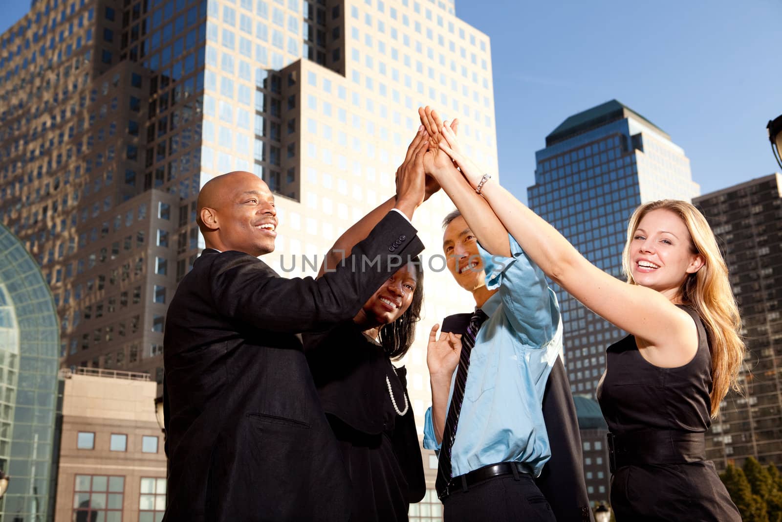 A group of business people happy and celebrating