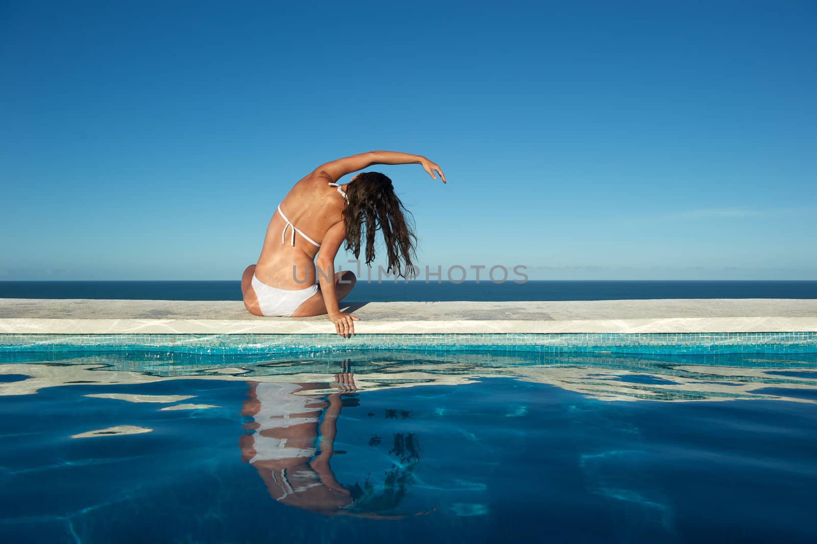 Woman relaxing in the spa swimming pool in Arraial d'Ajuda, Brazil
