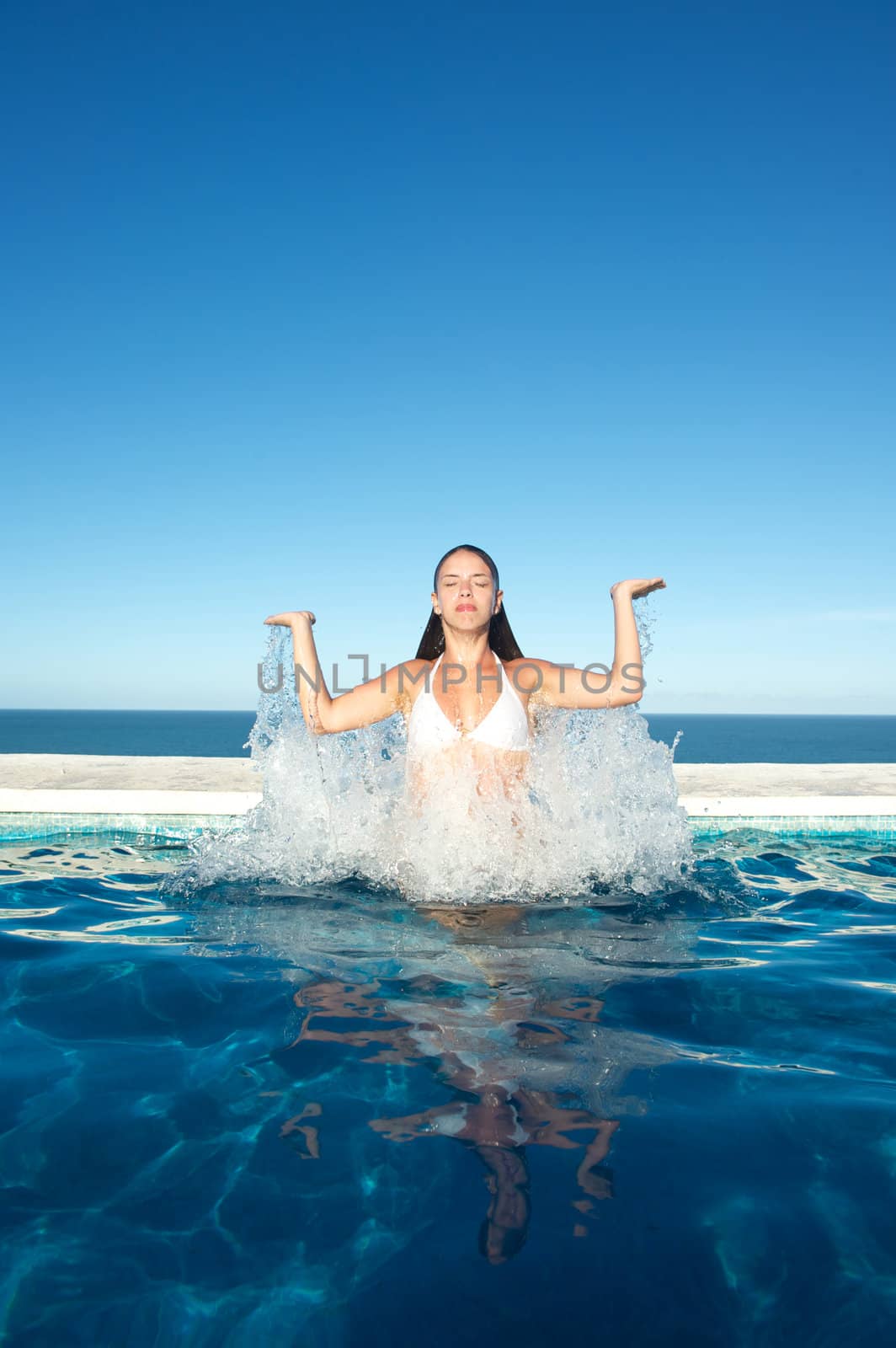 Woman relaxing in the spa swimming pool in Arraial d'Ajuda, Brazil