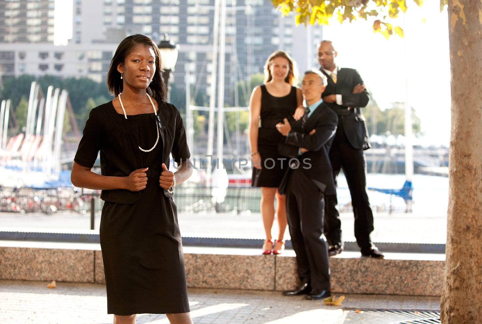 An African American woman in front of a business team
