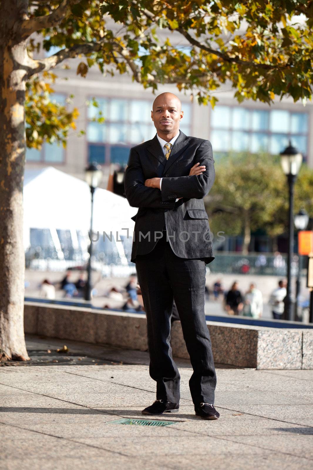 A business man in a city setting outside