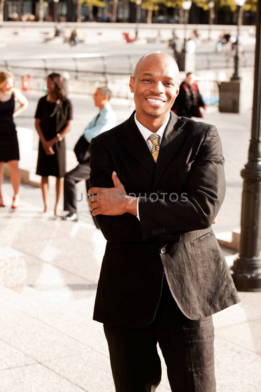 A portrait of a happy African American Business Man outdoors