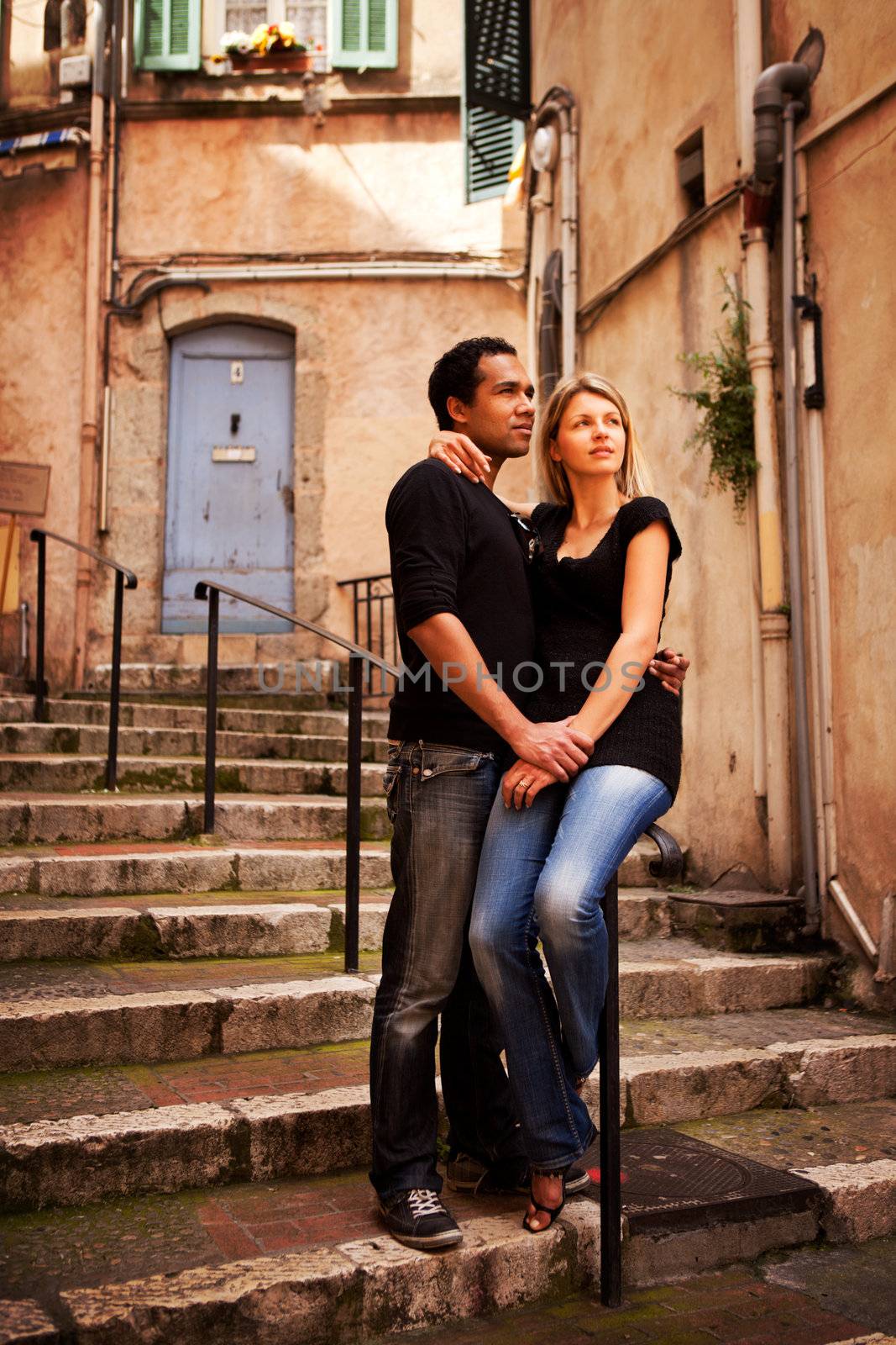 An attractive couple in a quaint european street