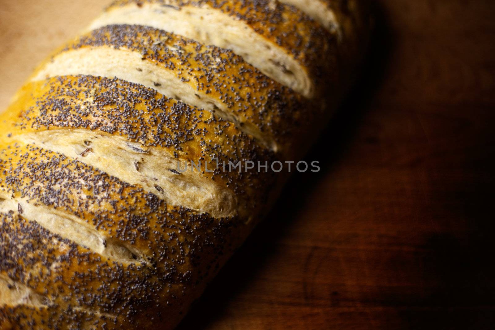 Fresh home-made onion and wild rice bread garnished with poppy seeds with copy space