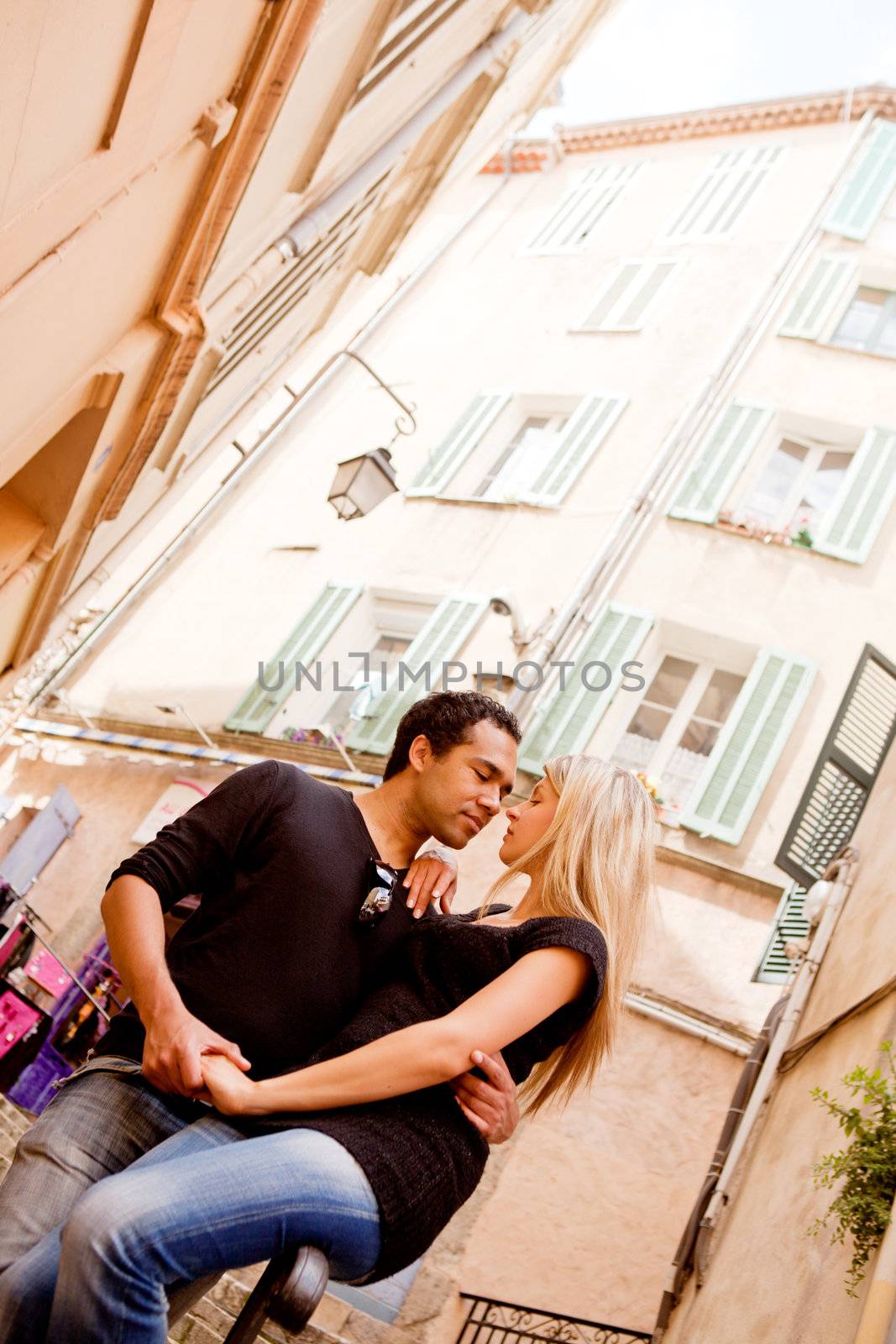 A happy european couple in a small quaint street