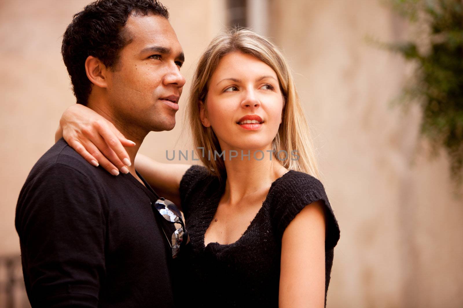 A beautiful couple in an outdoor urban setting