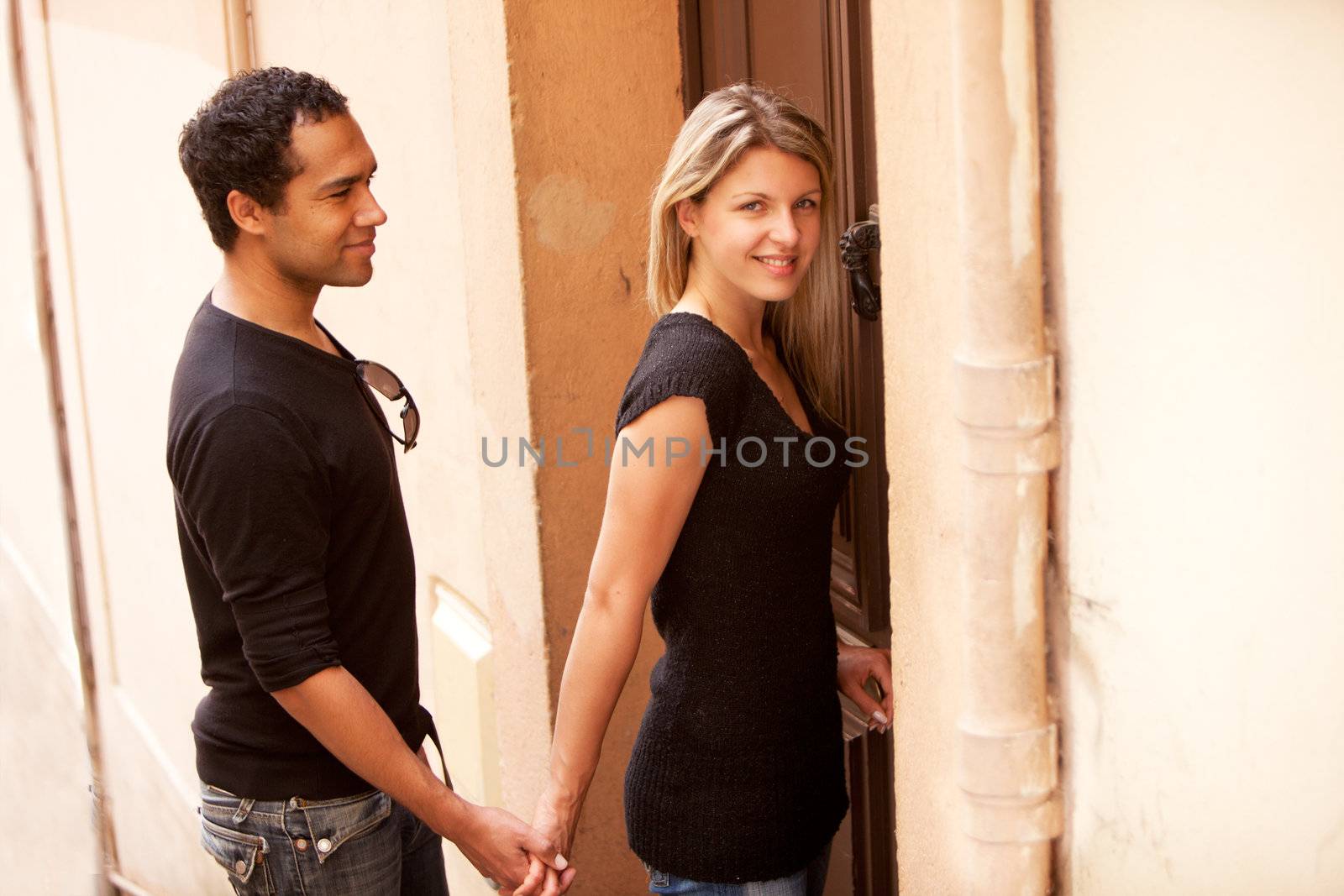 A happy couple in an outdoor European quaint street
