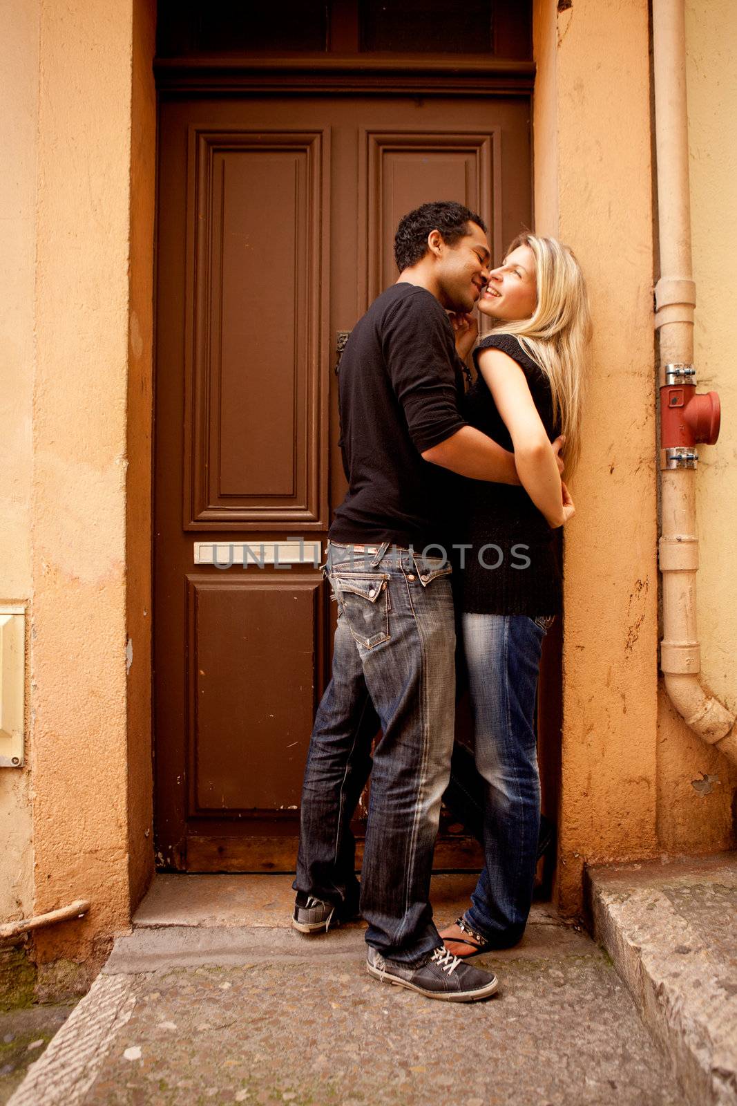 A couple having fun and flirting in an European French Street