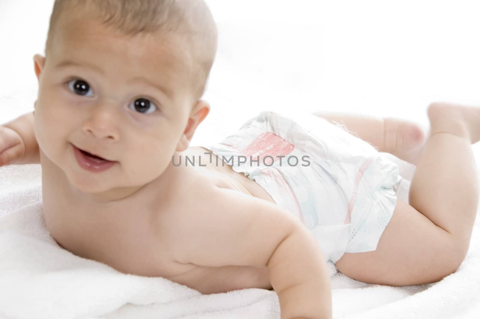 smiling baby lying with white background