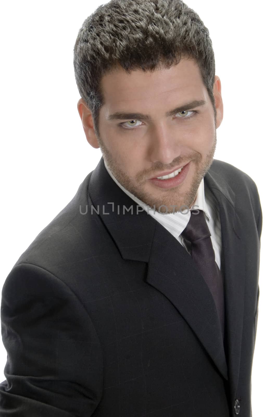 smiling businessman looking to camera against white background