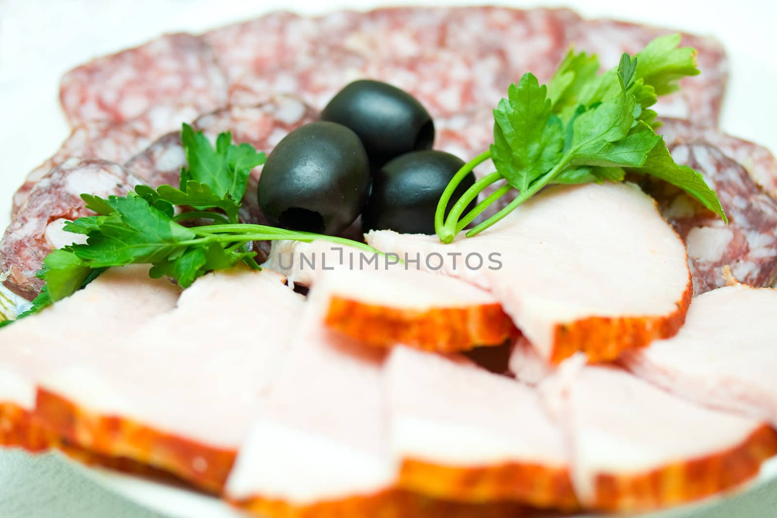 set of sausage  and olives, on plate