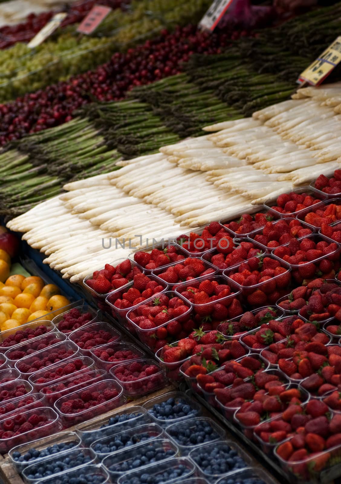 A stall at a street market selling fruits and vegetables