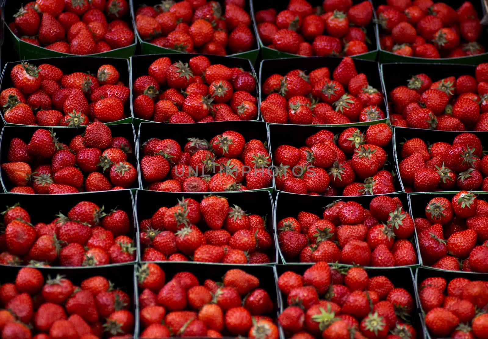 Boxes of strawberries on display at a street stall