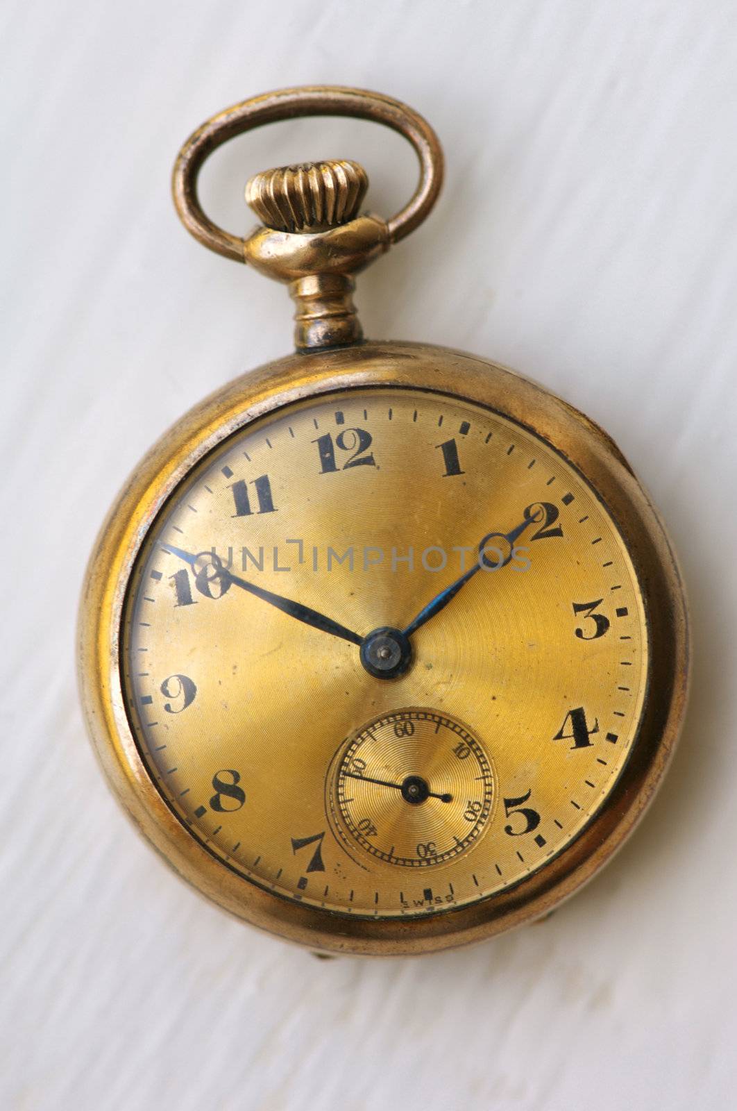 Close up image of an antique gols watch