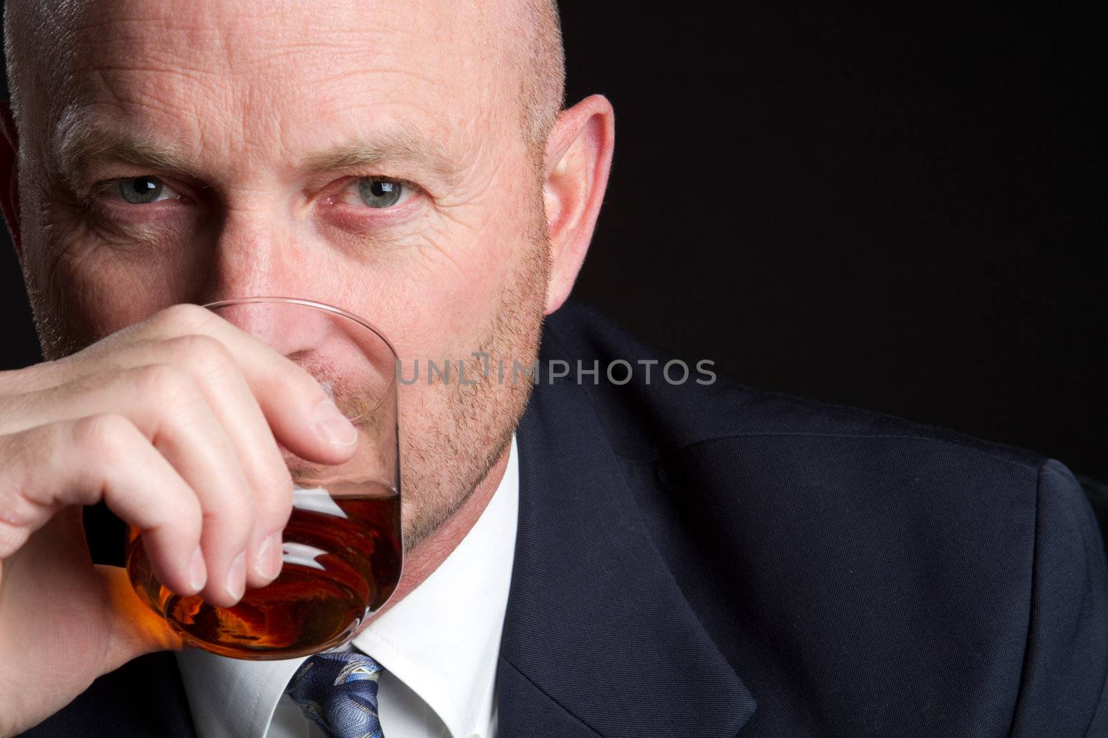 Businessman drinking alcohol