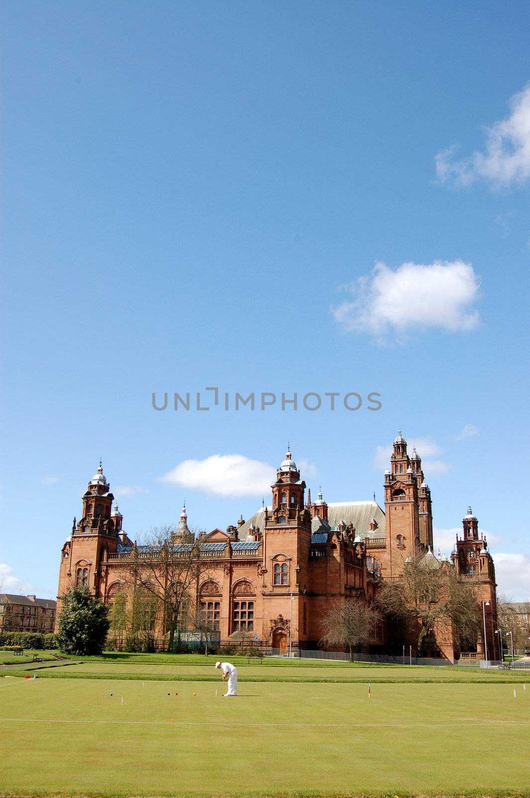 Kelvingrove Art Gallery with man playing croquet in foreground