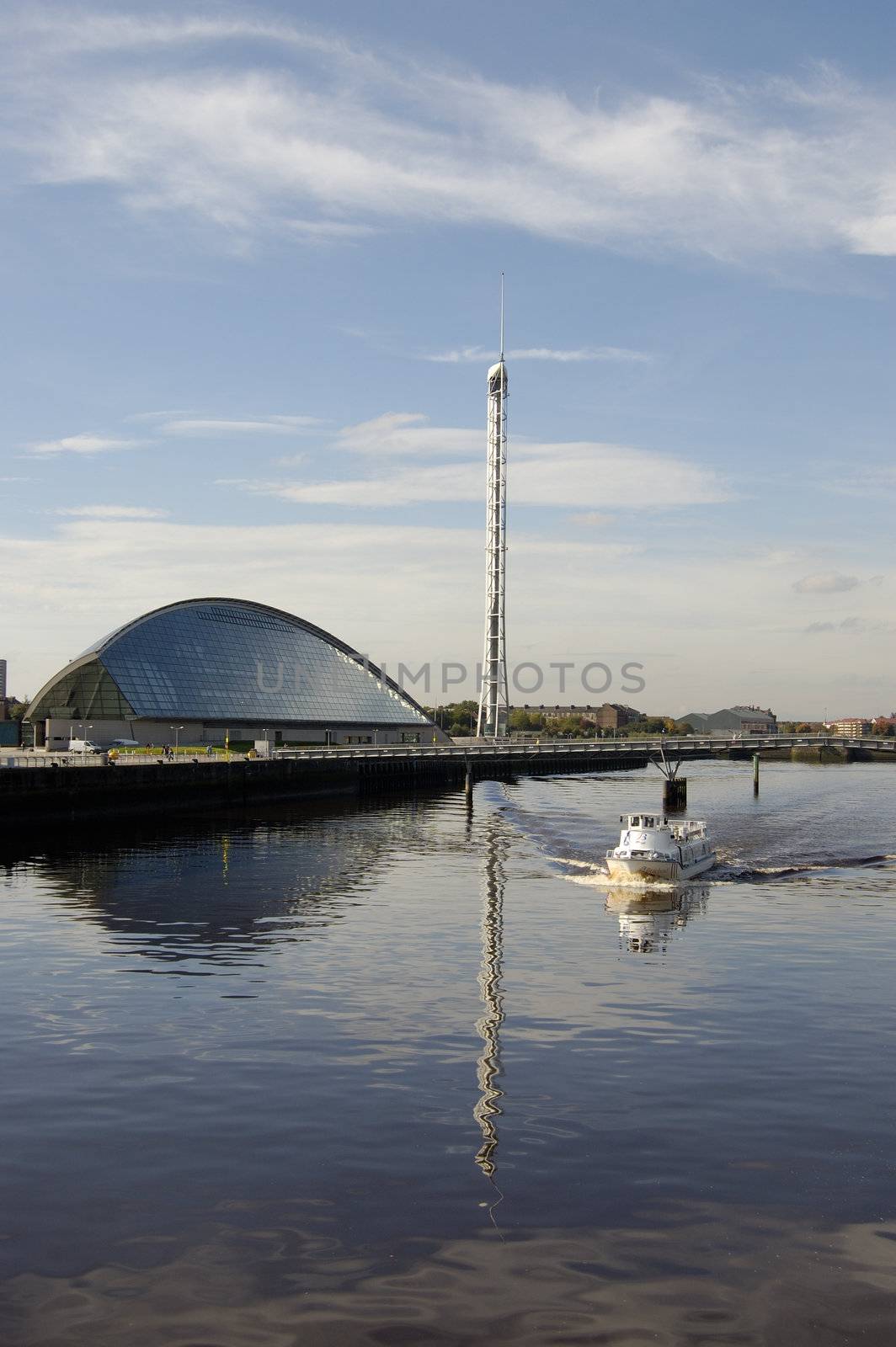 The Braehead Ferry on the river Clyde passing the Glasgow Science Centre