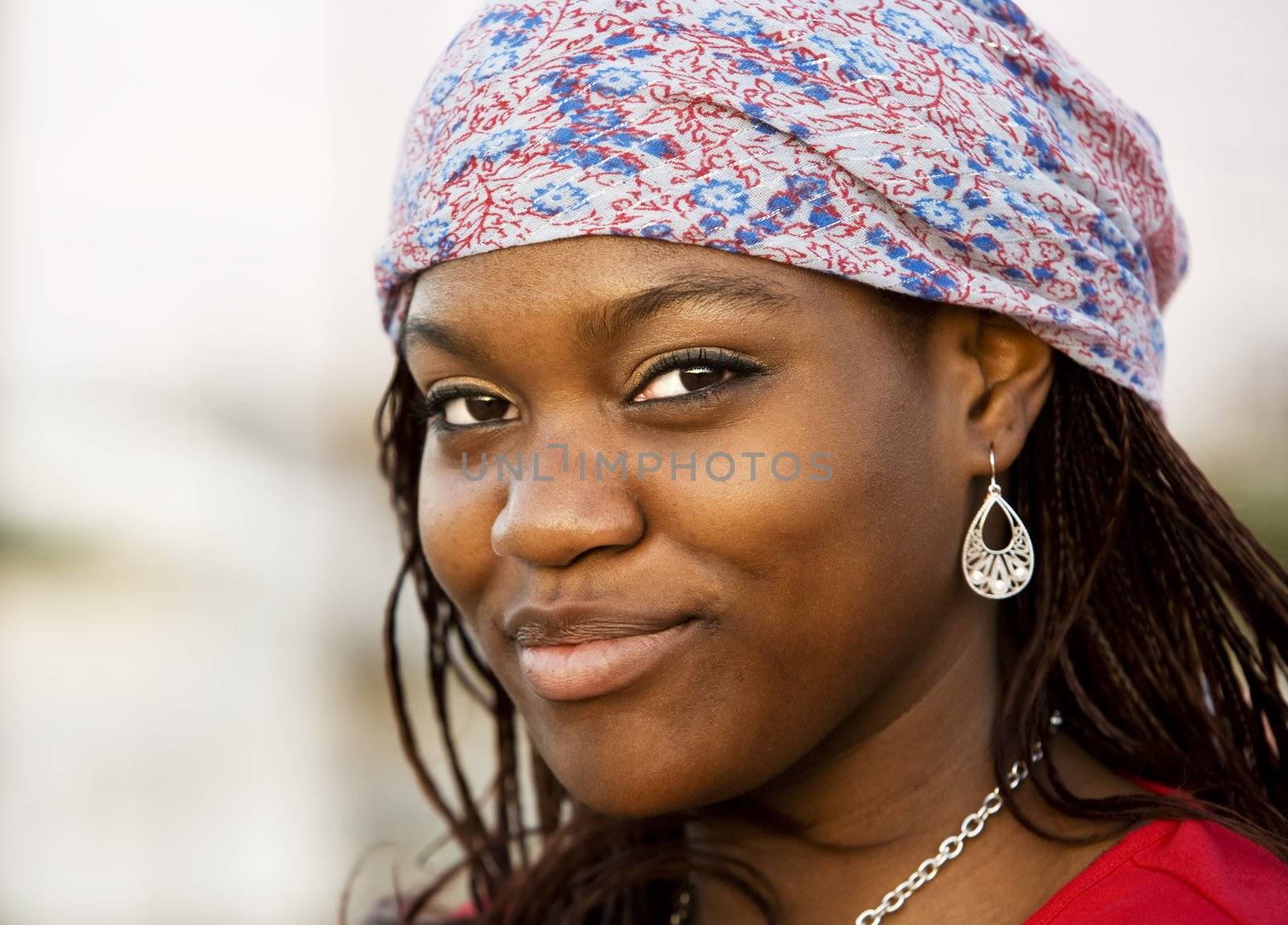 Closeup of a pretty African American woman with a scarf