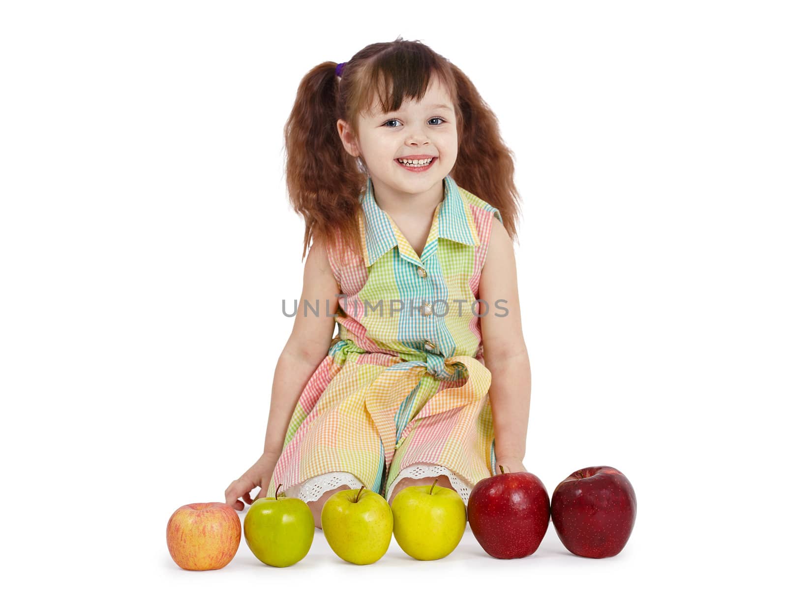 Happy child with apples of different color and size by pzaxe