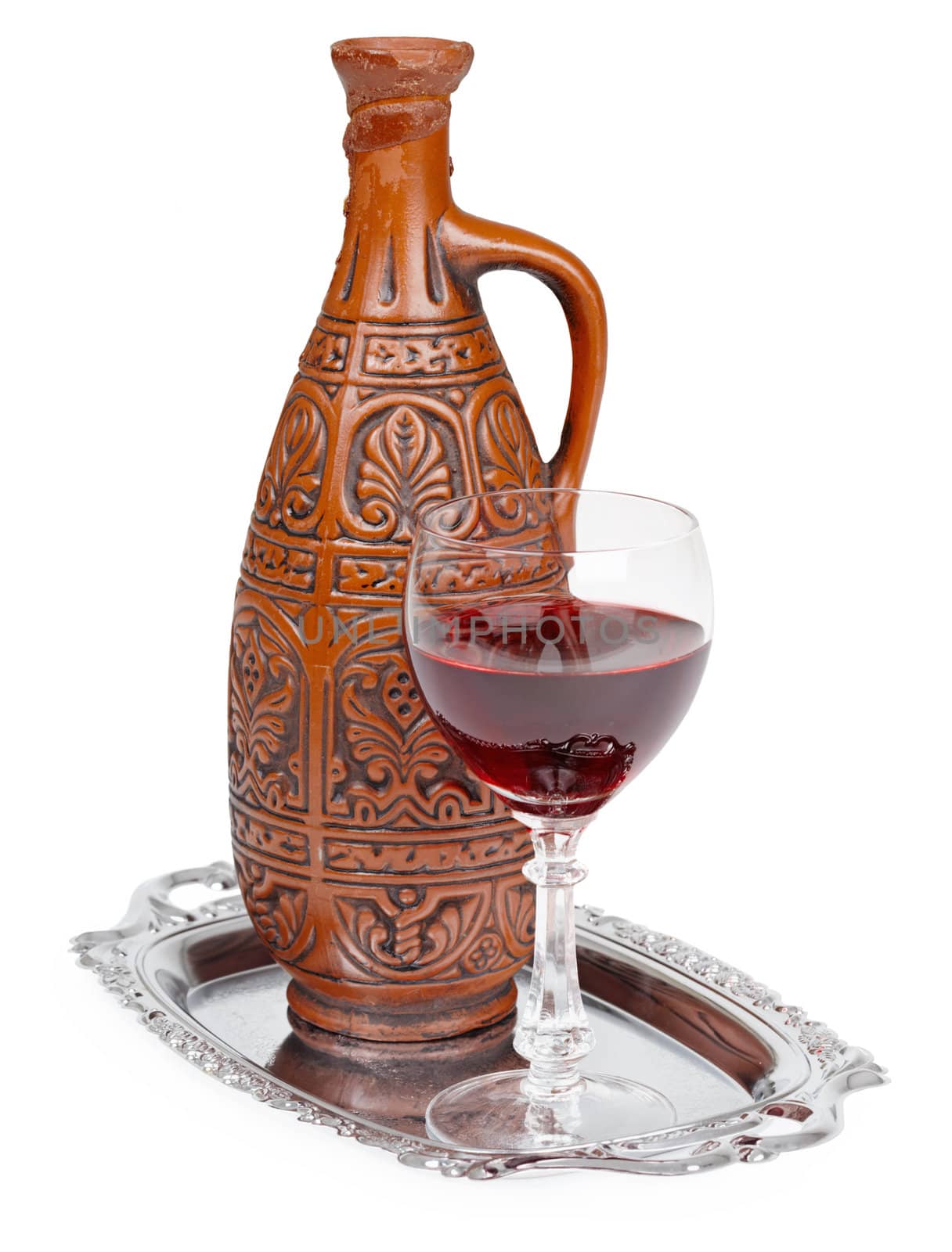 Ancient ceramic bottle with Georgians wine on a white background