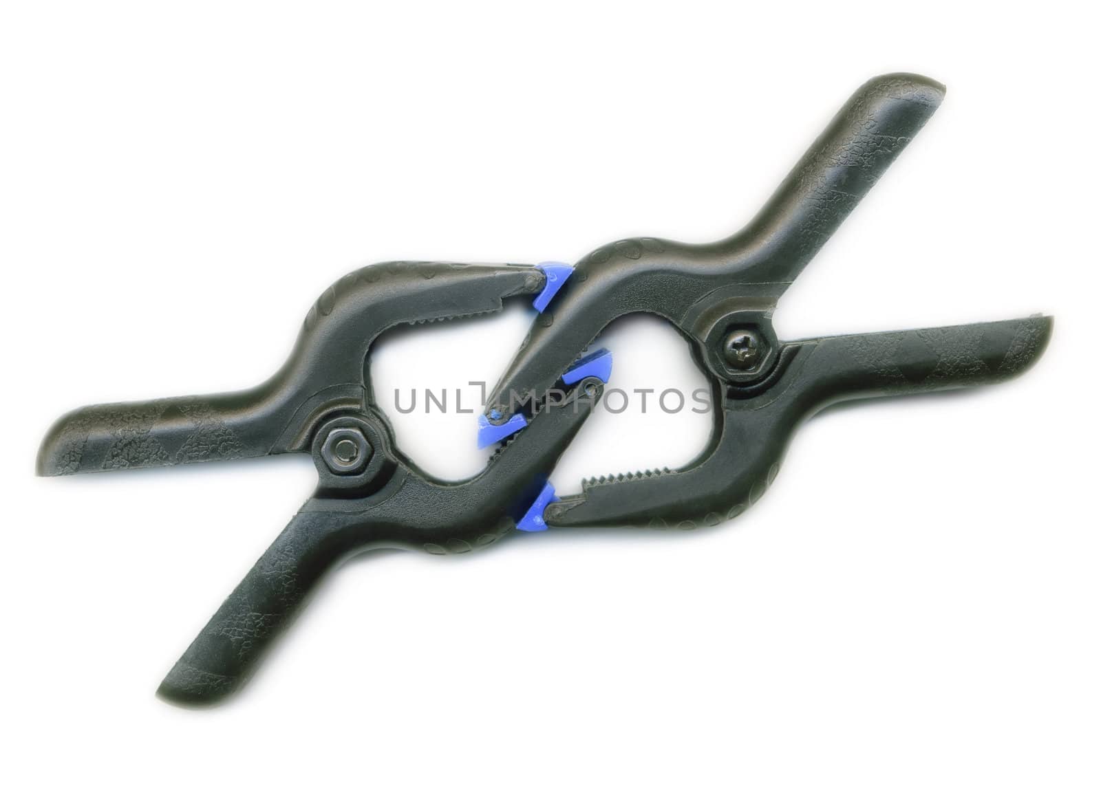 Two clamps hold each other on white background