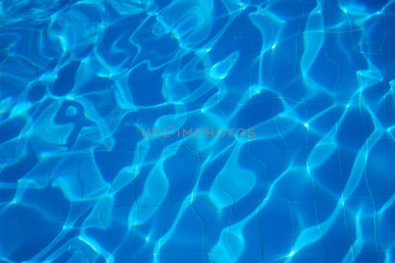 blue rippled water of swimming pool