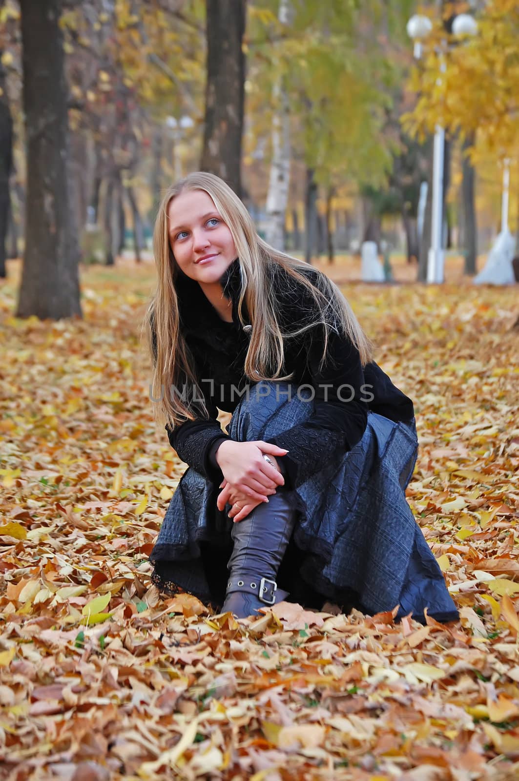 Charming girl in autumn park