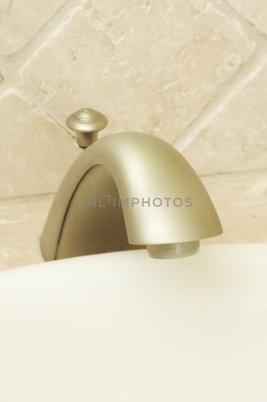 Close-up of Sink Faucet and Tile.