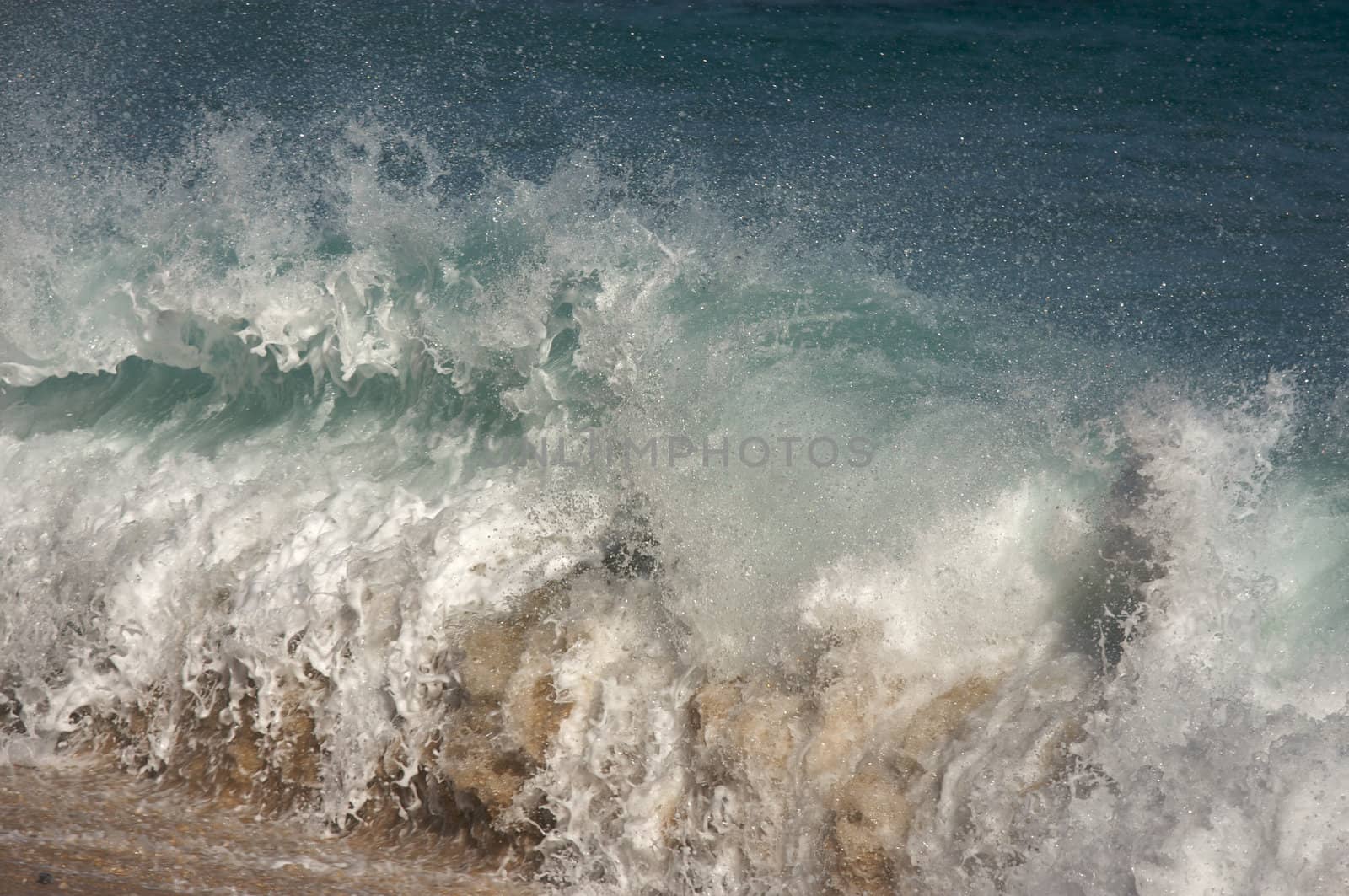 Dramatic Shorebreak Wave on a clear morning.
