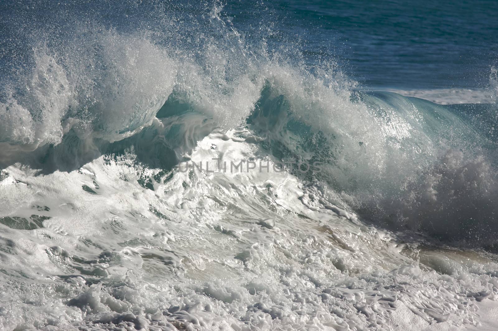 Dramatic Shorebreak Wave on a clear morning.