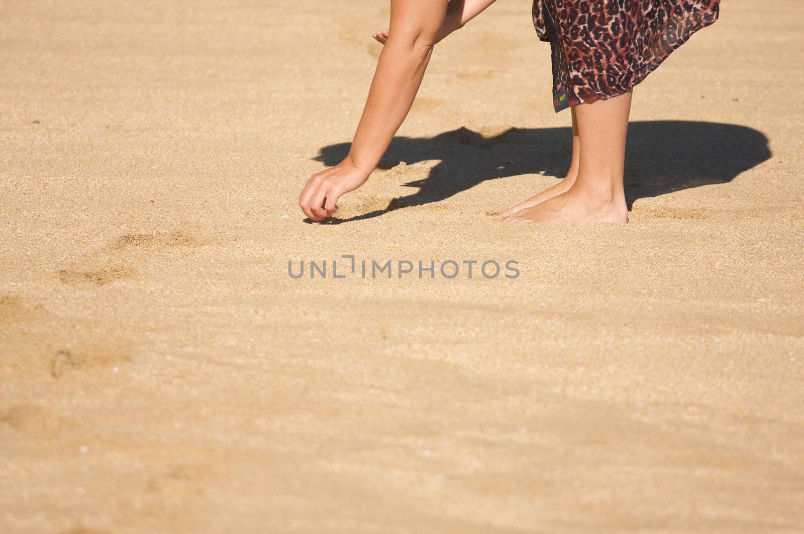Woman Shell Searching on a Beach in Hawaii