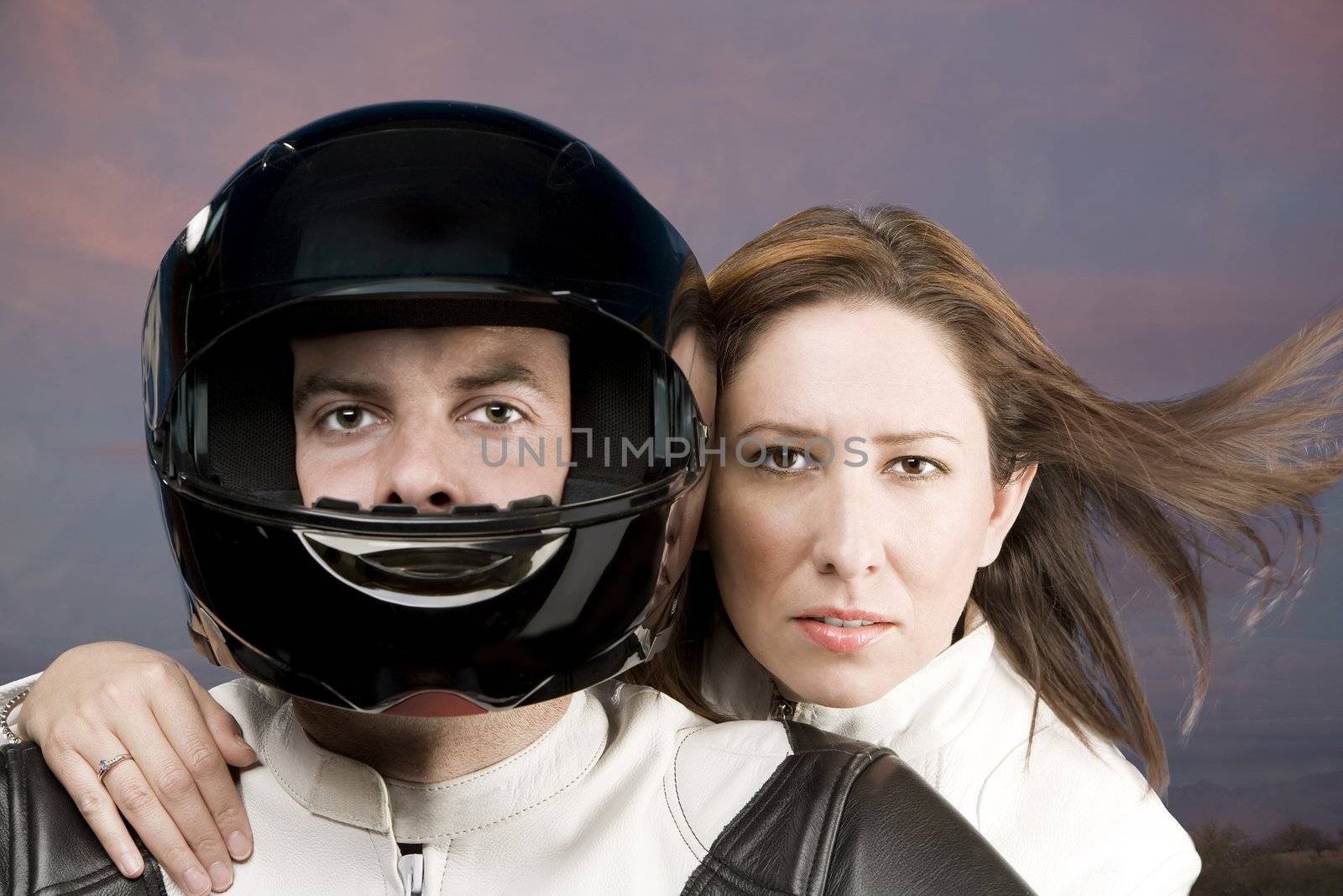 Man and woman on a motorcycle in studio