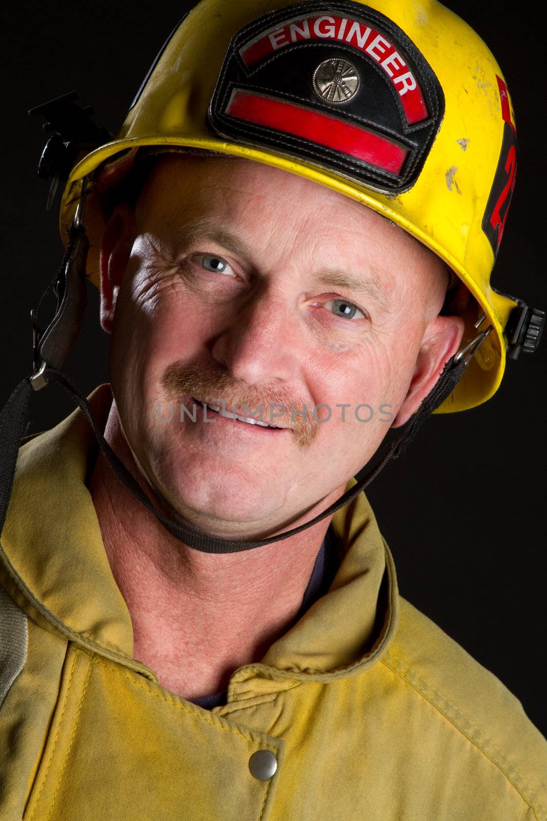 Smiling fireman wearing helmet