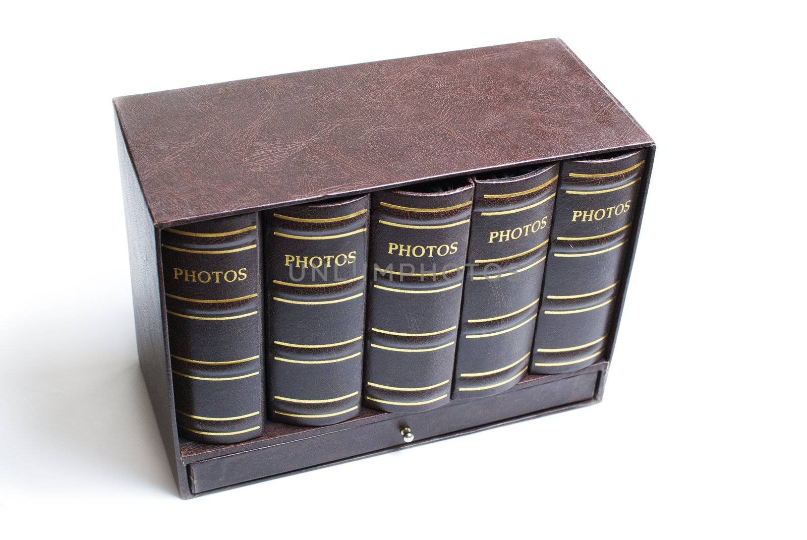 Five photo books in mini bookcase isolated on white background