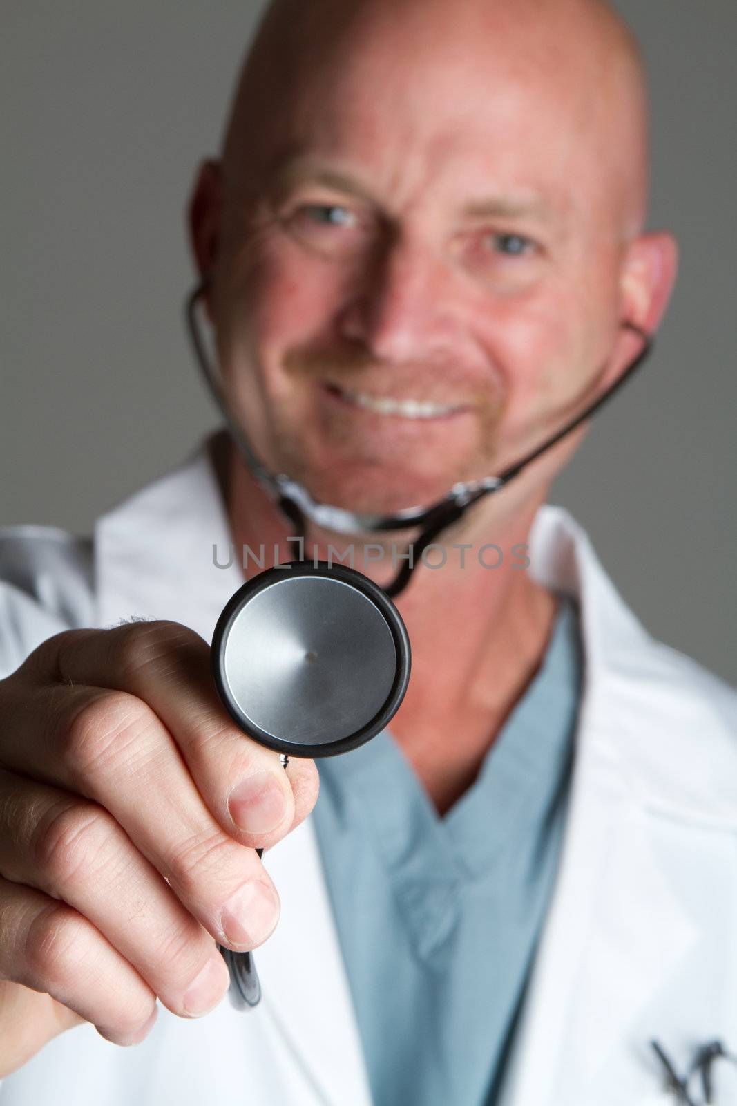 Smiling doctor holding stethoscope