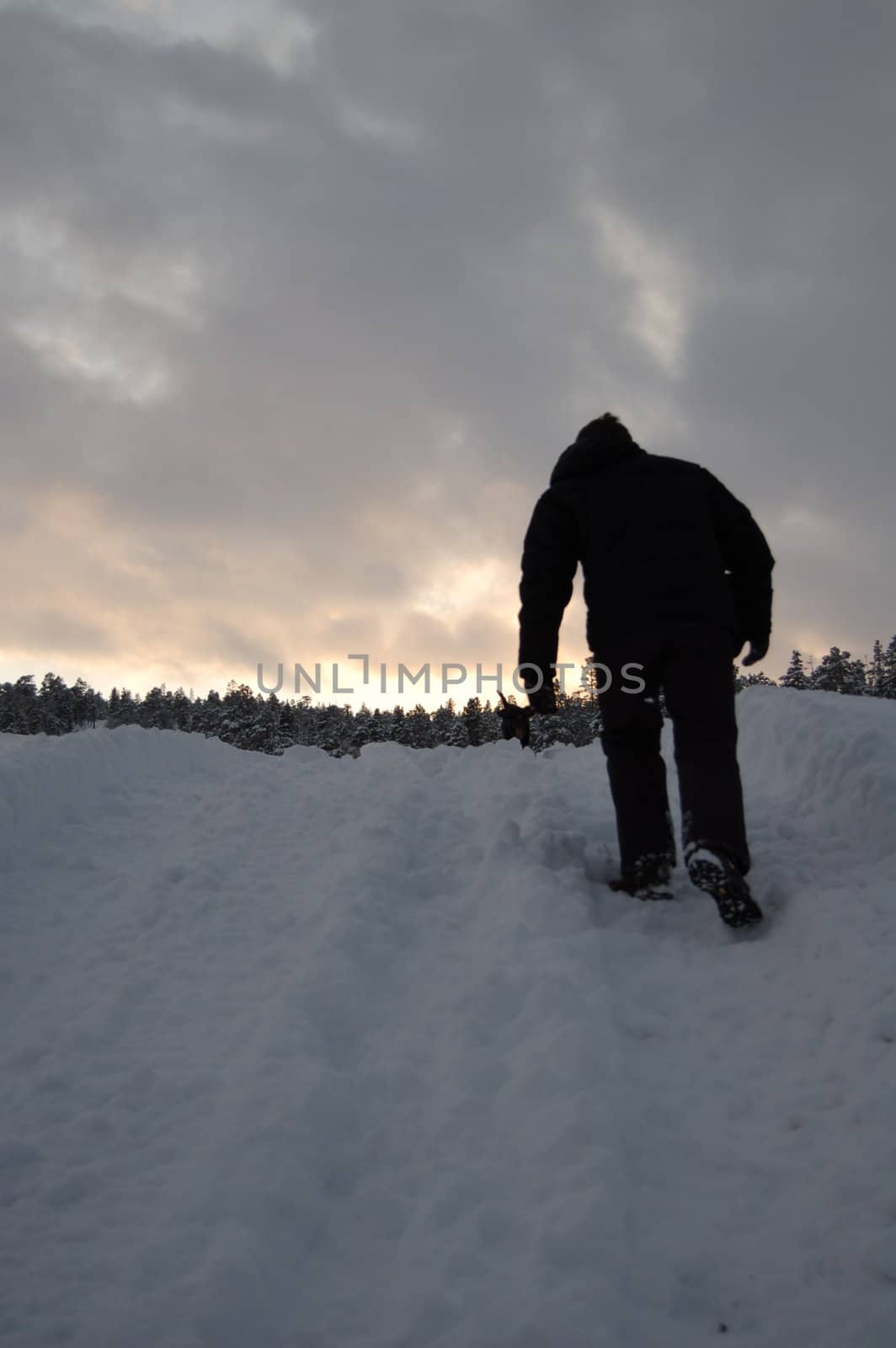 man walking up a hill