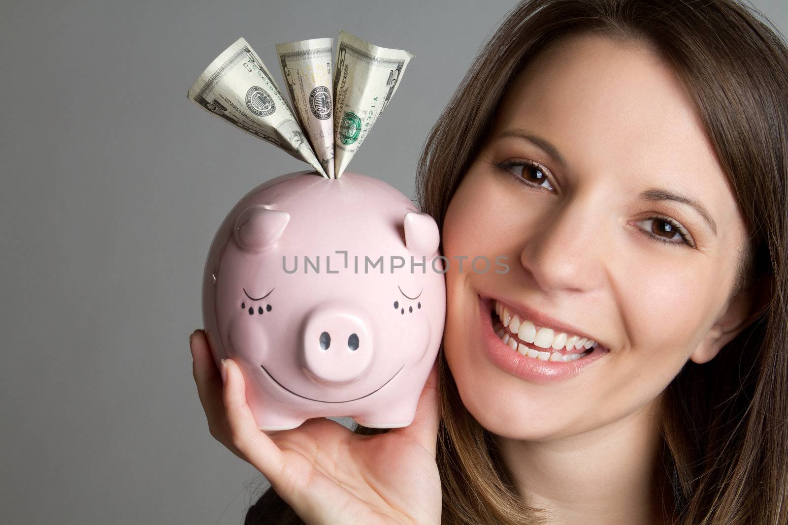 Smiling woman saving money