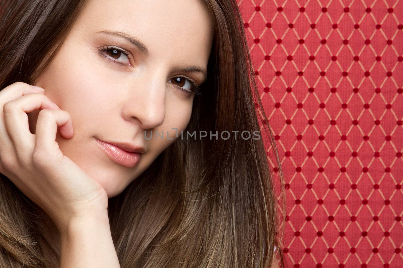 Pretty young woman on red background